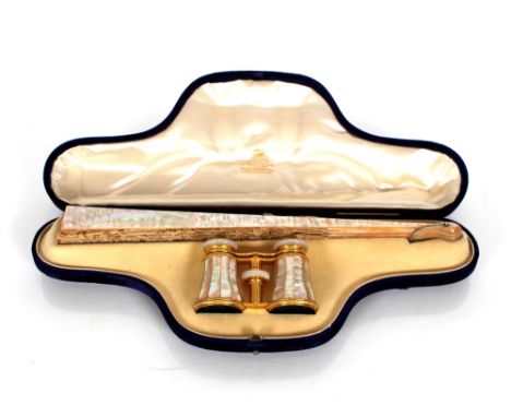 A late Victorian cased mother of pearl fan and opera glasses set, contained in a shaped blue plush case, the silk lined inter