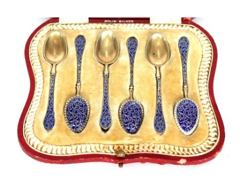 A cased set of six silver gilt and enamel decorated teaspoons, stamped ECK Norway, the velvet leather case for Edward Jewelle