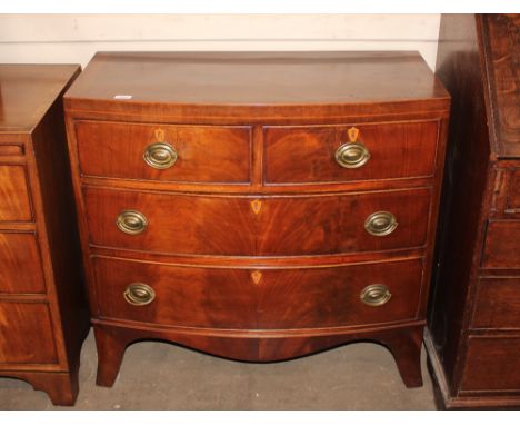 A 19th Century mahogany bow fronted chest of two short and two long drawers, raised on a shaped apron and bracket feet, 88cm 