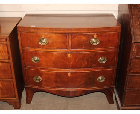 A 19th Century mahogany bow fronted chest of two short and two long drawers, raised on a shaped apron and bracket feet, 88cm 