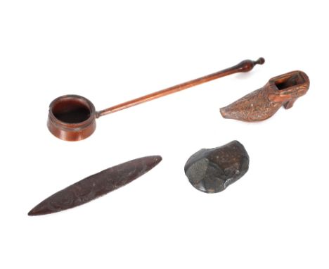 A rustic treen ladle; a treen shoe shaped nutmeg grater etc.