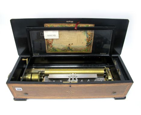 A Mid XIX Century French Musical Box, the rosewood case inlaid with musical instruments and flowers, brass carrying handles, 