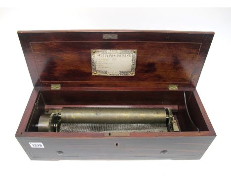A Mid XIX Century Nicole Fréres Cylinder Wind-Up Musical Box, the rosewood case with inlaid scrolling foliage decoration and 