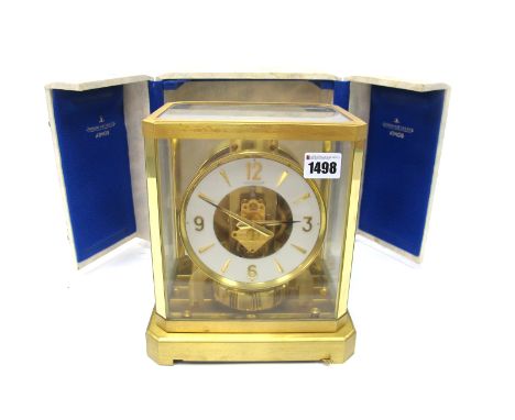 A Jaeger Le Coultre Atmos Clock, with lacquered gilt brass case, the cream chapter ring with baton and Arabic numerals to qua