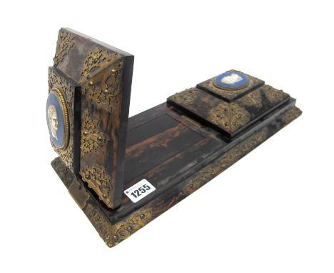 A Mid XIX Century Betjeman's Patent Self Closing Book Slide, in coromandel wood elaborately applied with pierced and engraved