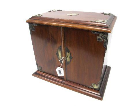 An Early XX Century Mahogany Table Top Cabinet, the doors opening to reveal a single drawer and fitted compartments containin