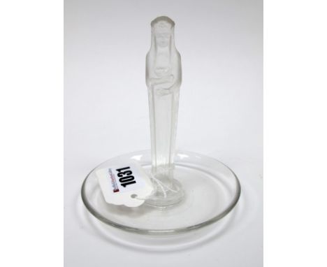 A Lalique Clear Glass Ring Tree, the central part frosted female figure holding a posy of flowers, upon a dished circular bas