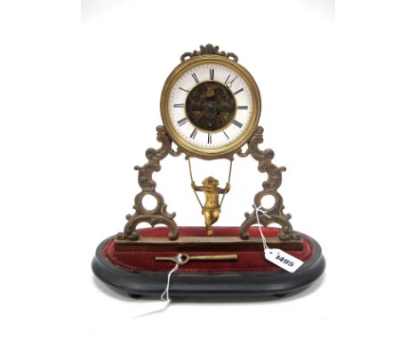 A Late XIX Century French Mantle Clock, the gilt metal scrolling support centrally hung with a gilt cherub on a swing, the wh