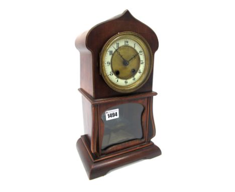 A Late XIX Century Mahogany Cased Mantel Clock, the shaped case with brass and cream enamel dial with Arabic numerals, key an