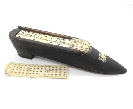 A Napoleonic Prisoner of War Games Shoe, the sliding bone lid in the form of a cribbage board, containing a set of dominoes, 