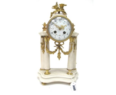A Late XIX Century French Alabaster and Gilt Metal Mantel Clock, the four pillars applied with floral swags and musical instr