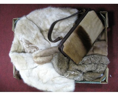 A Cream Fur Capelet, mink scarf, dark fur stole, Davy Crockett style fur hat and a springbok handbag.