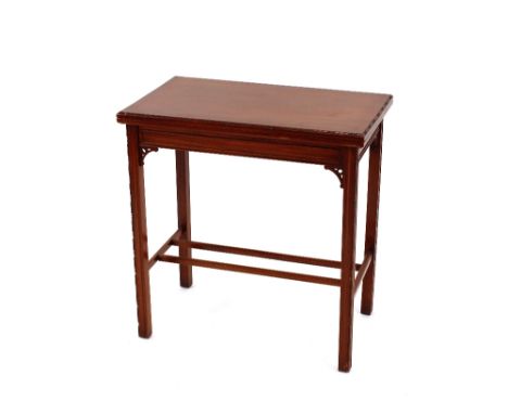 An Edwardian mahogany card table, with fold over rectangular top, raised on square section supports, with beaded edges, 73cm 