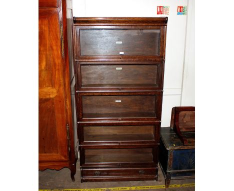 An oak Globe Wernicke five section bookcase,&nbsp;fitted single drawer to base, 88cm wide, 177cm high