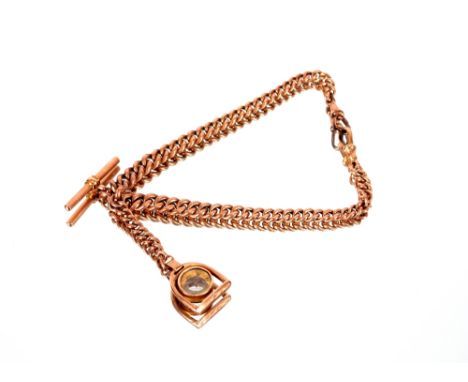 A 9ct gold watch chain,&nbsp;with attached stirrup shaped fob, inset with a compass, total approx. weight 19gms