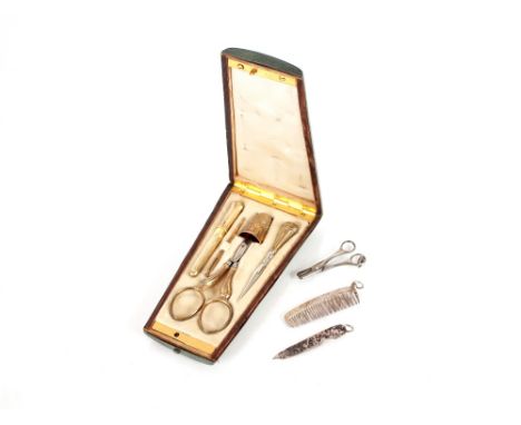 A 19th Century green leather shagreen effect cased etui,&nbsp;with yellow metal monogram, contents including scissors, a thim