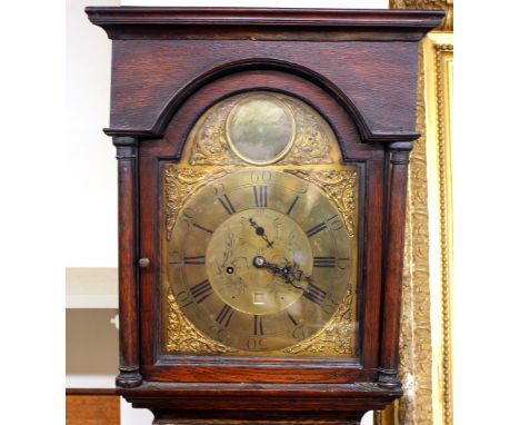 An 18th Century oak long case clock, by George Chambers, Gateshead, the arched brass spandrel dial with foliate scroll decora