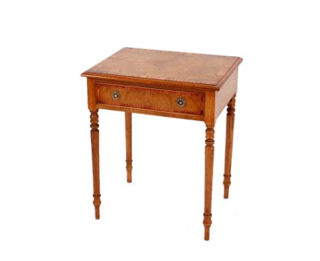 A pair of burr ash cross banded lamp tables,&nbsp;fitted single drawers raised on turned tapering supports, 63cm wide, 49cm d