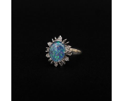 14 carat white gold, set with opal and 6 diamonds, ring size 17