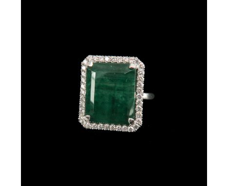 18 carat white gold, set with natural emerald-cut emerald of 12.64, surrounded by 39 brilliant-cut diamonds of approximately 