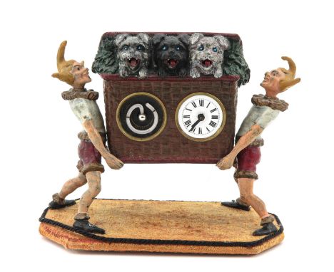 metal with 3 dogs, carried by 2 gnomes / fairytale figures, on the pendulum movement the dogs stick their tongues out, with m