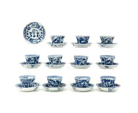 Blue and white decors, 23 pieces, including Kangxi mark and 18th Century, saucers are 13 cm. in diameter, chip and hairline.