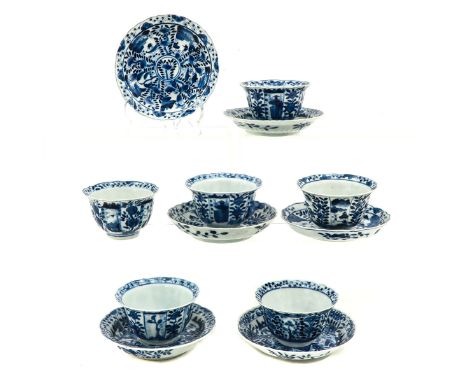 Blue and white floral and landscape decor, saucers are 13 cm. in diameter, chip and hairline.