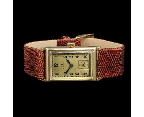 brand Omega, Tank / Tonneau, solid 14 carat gold case, 30 x 20 mm., 1938, on leather strap