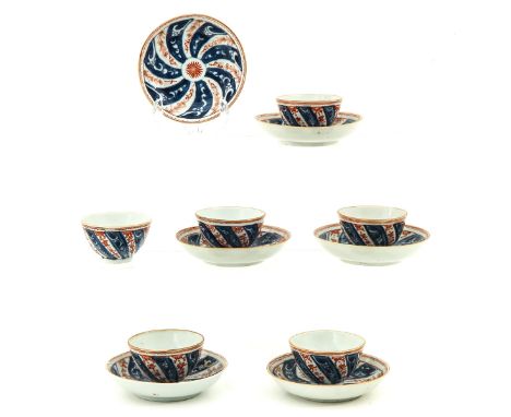12 pieces, iron red and blue floral decor, 18th Century, saucers are 11 cm. in diameter, chip and hairline.