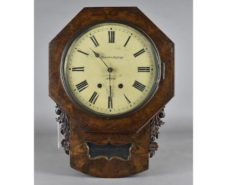 A 19th Century walnut veneered drop dial wall clock, the octagonal surround and carved floral ears, with an open window drop,