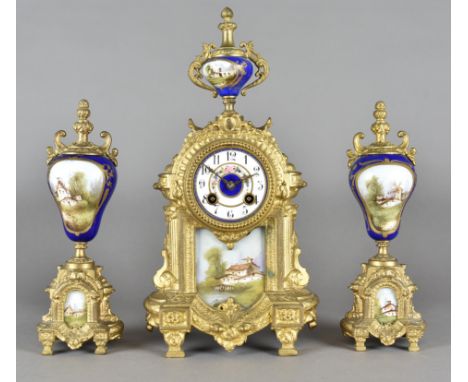 A 19th Century gilt metal and continental porcelain mounted clock garniture, decorated with panels of painted landscapes, eig