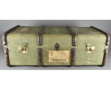 A canvas travel trunk, with wooden strapping, brass fittings having travel labels for Sydney, Perth etc