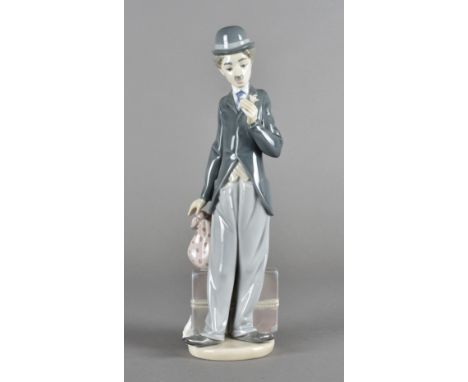 A boxed Lladro figure of Charlie Chaplin, in light blue box