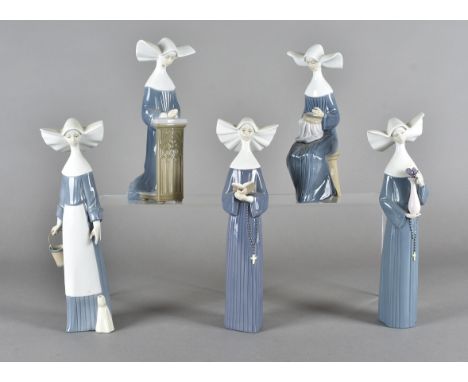 A collection of five Lladro figures, all modelled as nuns, kneeling, sleeping etcAll dusty. The nun with a bucket has a chip 
