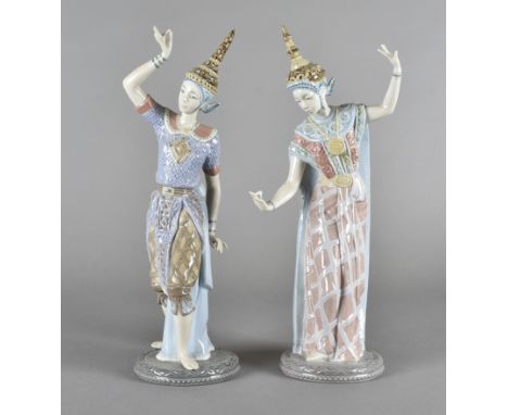 A pair of Lladro figures, modelled as Siam dancers, 33 cm highVery good condition. Slight rubbing to bases but no apparent cr