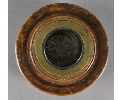 A 19th Century box wood and brass travelling ships compass, the turned case in three sections, holding a brass glass compass 