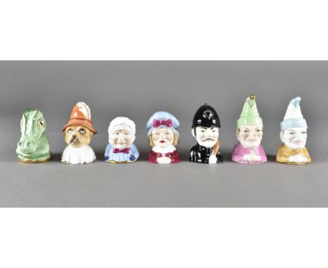 A collection of Royal Worcester Candle Snuffers, including Punch, Toby, Judy, limited Mr Punch 374/600, baby, crocodile, poli