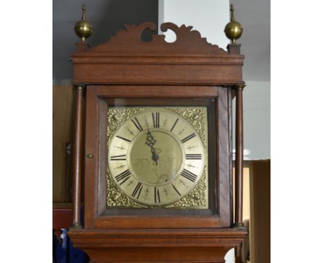 A 30 hour oak cased long case clock, with brass face, single hand, four post movement