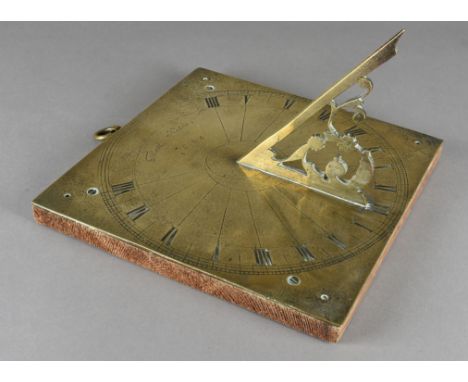 A 17th Century brass sundial, by Thomas Mason dated 1684, the square brass plaque, with Roman numerals, and brass scroll gnom