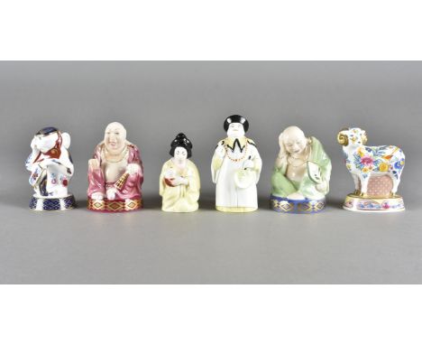 A collection of Royal Worcester Candle Snuffers, including smiling Buddha, sleeping Buddha, Mandarin, Japanese girl, Chinese 