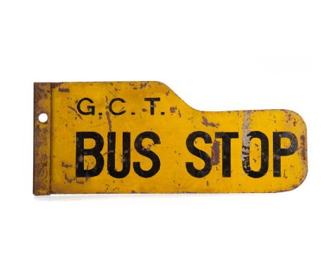 CAST IRON AND ENAMEL SIGN,'G. C. T. Bus Stop', 46cm wide, and a BR(M)M lamp (2)