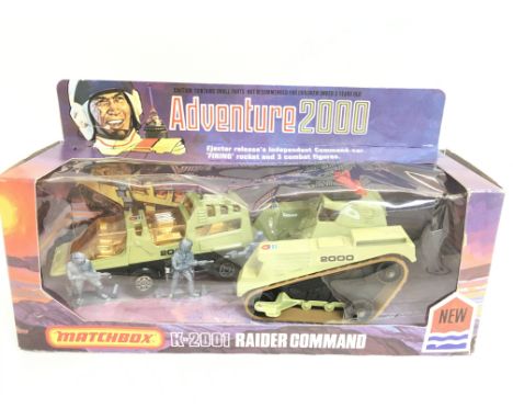 A Boxed Matchbox K-2001 Adventure 2000 Raider Command. Plastic Cover is Damaged.