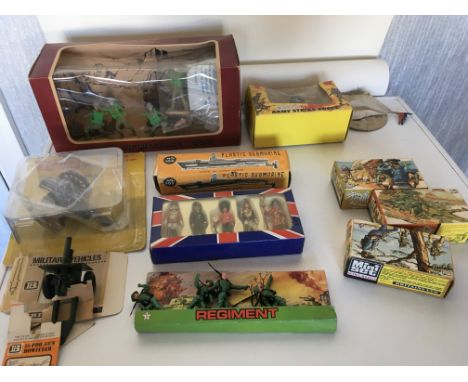 An 11 item Collection of old toys by Britains..Cherilea..Lone Star..Timpo and others. Most in original packaging.
