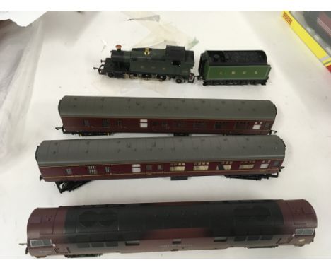 An unboxed pair of locomotives Hornby Western Invader D1009 weathered edition with 2 coaches. A Lima engine with tender.
