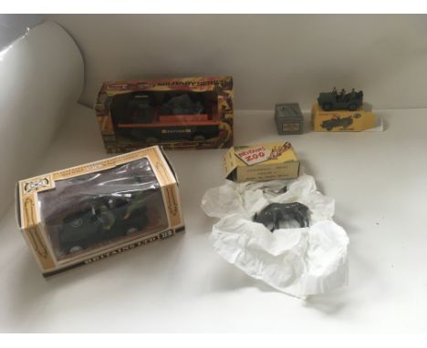 A collection of model toys in original packaging by Britains . Triang . Dinky and Charbens