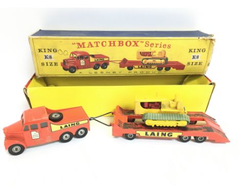 A Boxed Matchbox King Size K-8 Laing Prime Mover Transporter with Caterpillar Tractor Trailer.