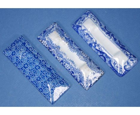 Three Spode pearlware knife rests various transfer printed blue and white patterns. Each with printed SPODE mark to underside