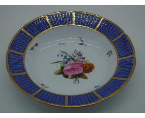 Spode handpainted bone china bowl central floral decoration gilded basket weave rim on blue ground. Printed red Spode mark to
