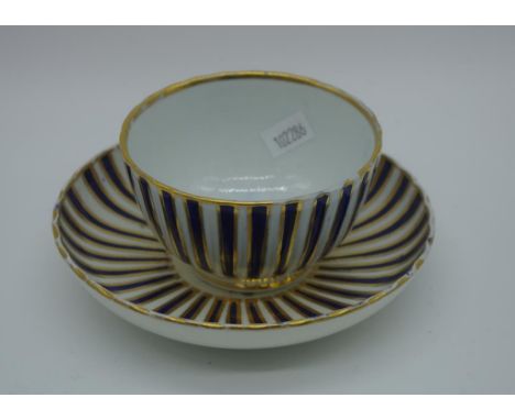 Spode hand painted tea bowl & saucer with inner blossom decoration, with cobalt blue and gilded external decoration. Hand pai