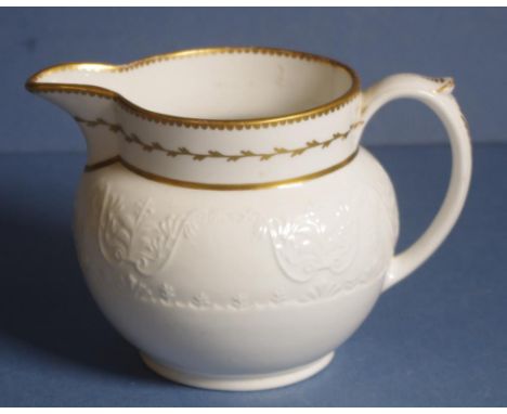 Spode bone china milk jug embossed swag decoration with gilded highlights. Spode mark to base. H11cmc approx.